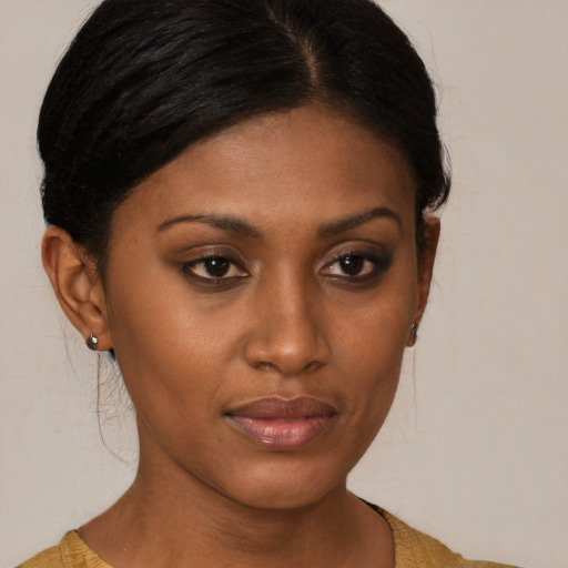 Neutral black young-adult female with medium  brown hair and brown eyes