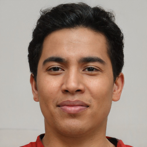 Joyful asian young-adult male with short  black hair and brown eyes
