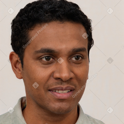 Joyful black young-adult male with short  brown hair and brown eyes