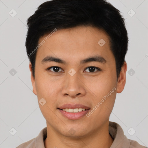 Joyful asian young-adult male with short  brown hair and brown eyes