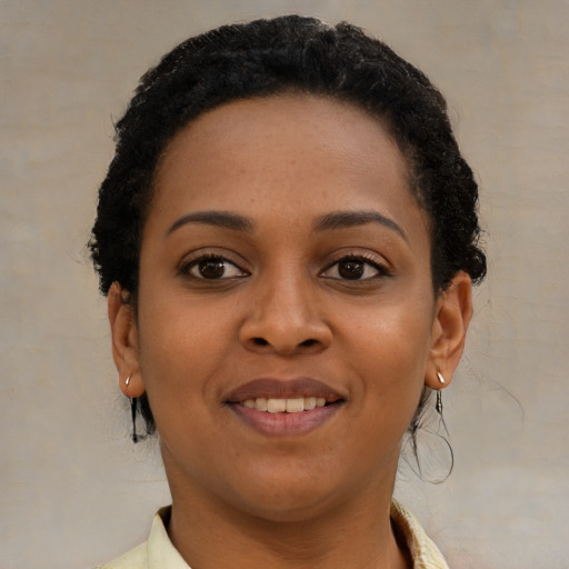 Joyful latino young-adult female with short  brown hair and brown eyes