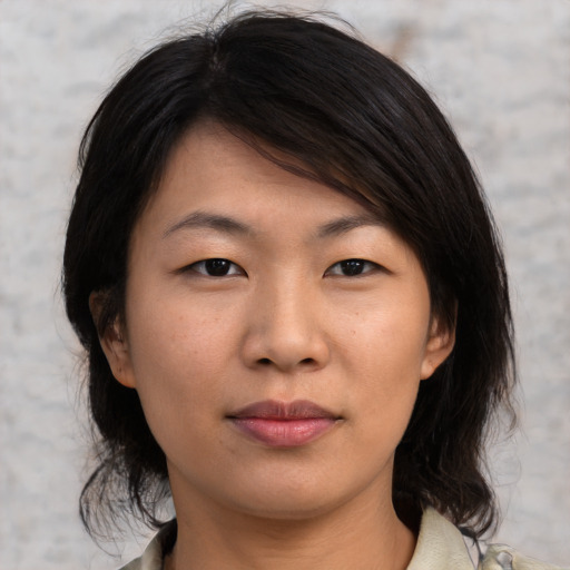 Neutral asian young-adult female with medium  brown hair and brown eyes