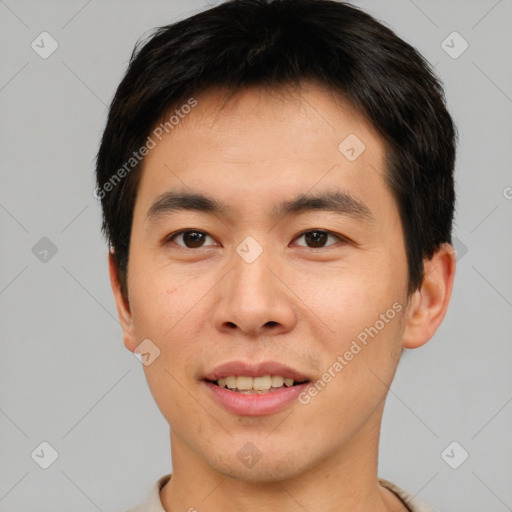 Joyful asian young-adult male with short  brown hair and brown eyes