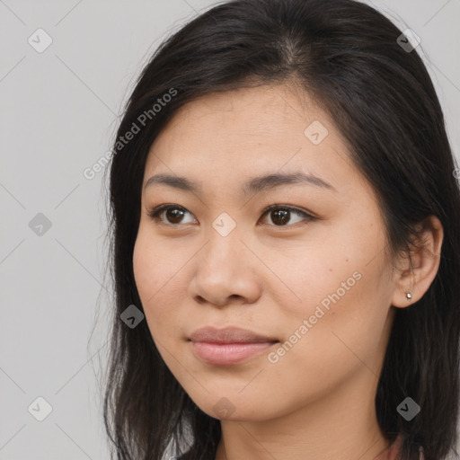 Joyful asian young-adult female with long  brown hair and brown eyes