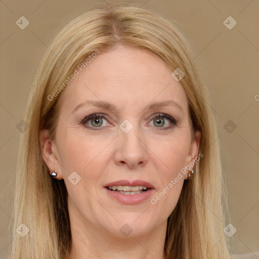 Joyful white adult female with long  brown hair and green eyes