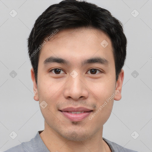 Joyful white young-adult male with short  black hair and brown eyes