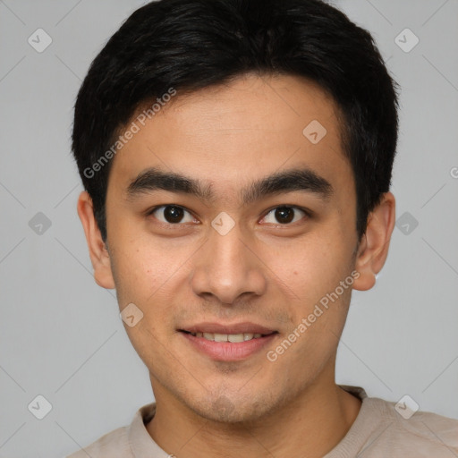 Joyful white young-adult male with short  black hair and brown eyes