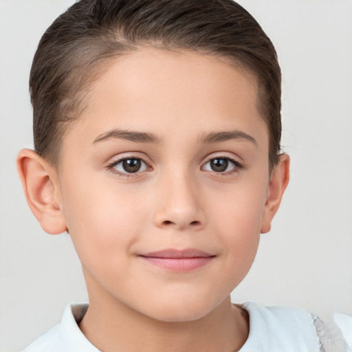 Joyful white child female with short  brown hair and brown eyes