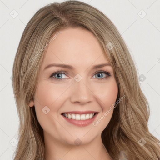 Joyful white young-adult female with long  brown hair and green eyes