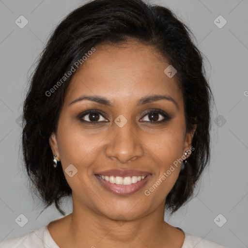 Joyful black young-adult female with medium  brown hair and brown eyes