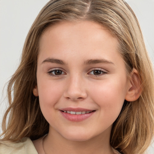 Joyful white child female with long  brown hair and brown eyes