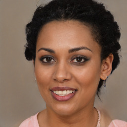 Joyful black young-adult female with medium  brown hair and brown eyes