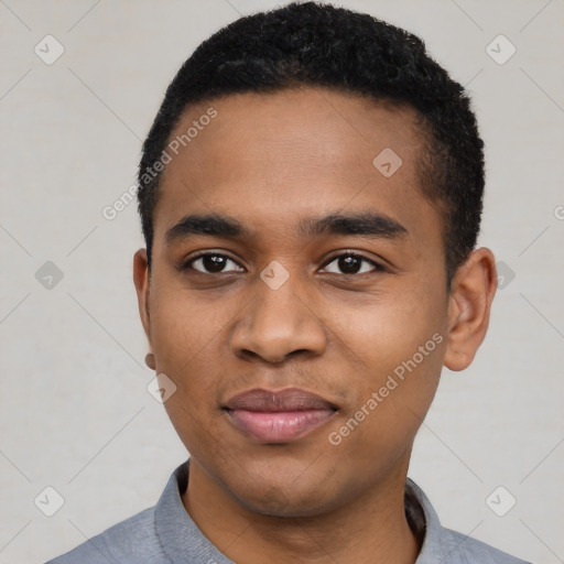 Joyful black young-adult male with short  black hair and brown eyes