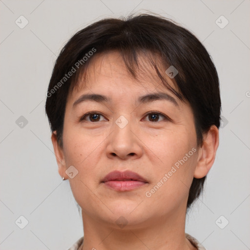 Joyful white adult female with short  brown hair and brown eyes