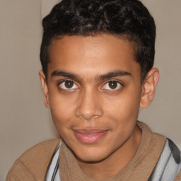 Joyful latino young-adult male with short  brown hair and brown eyes