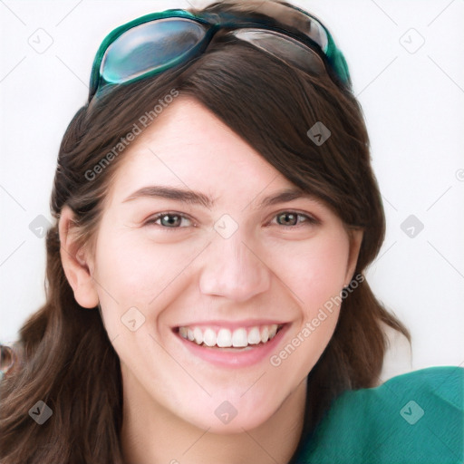 Joyful white young-adult female with long  brown hair and blue eyes