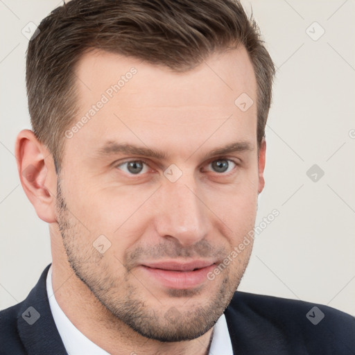 Joyful white young-adult male with short  brown hair and grey eyes