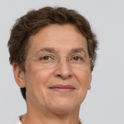 Joyful white middle-aged female with short  brown hair and brown eyes