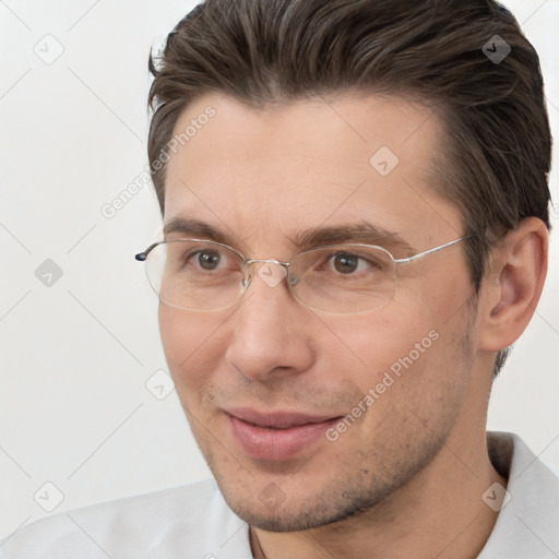 Joyful white adult male with short  brown hair and brown eyes