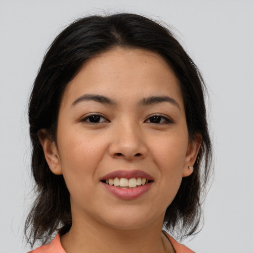 Joyful asian young-adult female with medium  brown hair and brown eyes