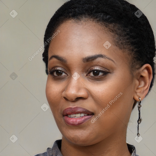 Joyful black young-adult female with short  black hair and brown eyes