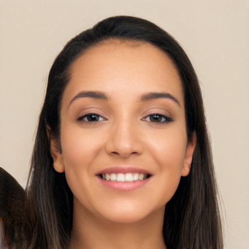 Joyful white young-adult female with long  black hair and brown eyes