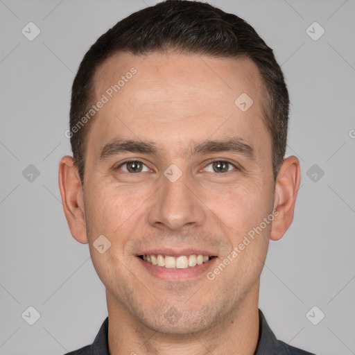 Joyful white adult male with short  brown hair and brown eyes