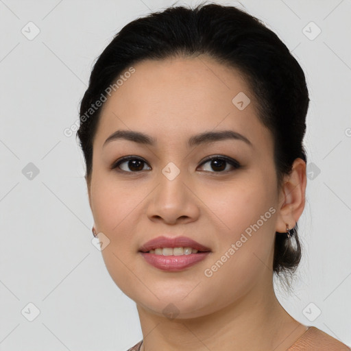 Joyful asian young-adult female with medium  black hair and brown eyes