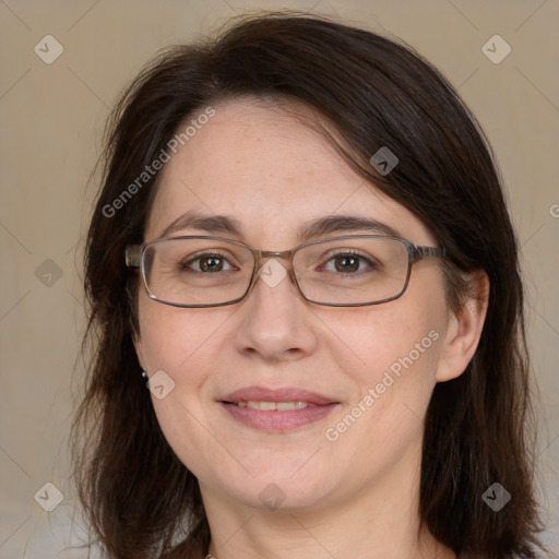 Joyful white adult female with medium  brown hair and grey eyes