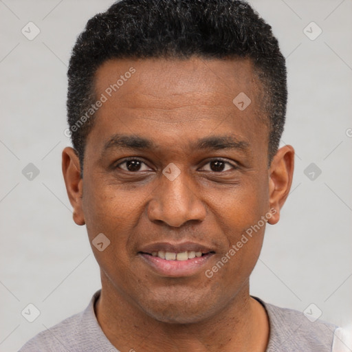 Joyful black young-adult male with short  black hair and brown eyes