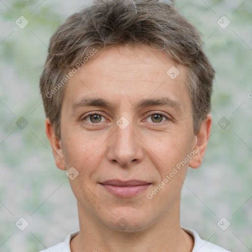 Joyful white adult male with short  brown hair and brown eyes