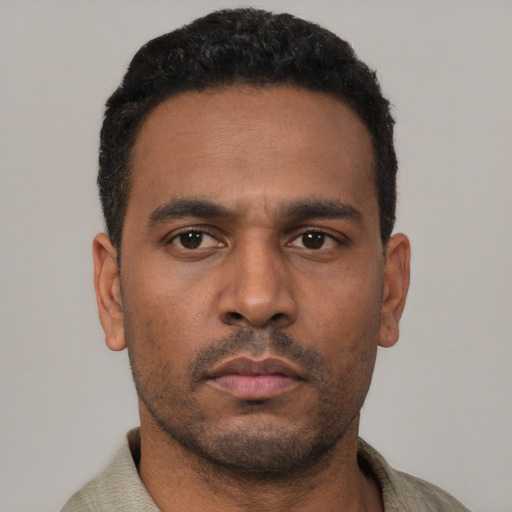 Neutral latino young-adult male with short  black hair and brown eyes