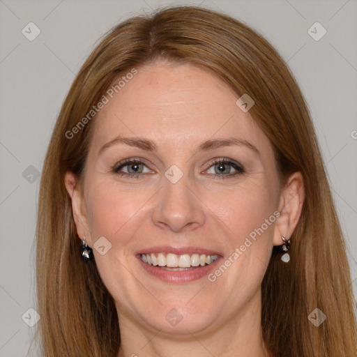 Joyful white adult female with long  brown hair and grey eyes