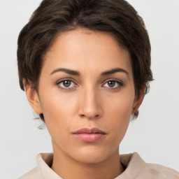 Neutral white young-adult female with short  brown hair and brown eyes