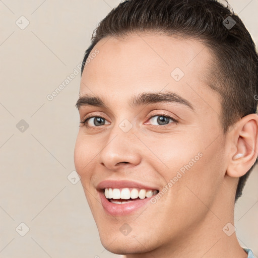 Joyful white young-adult male with short  brown hair and brown eyes