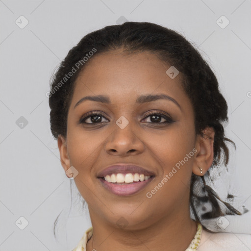 Joyful black young-adult female with long  brown hair and brown eyes