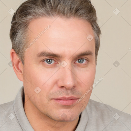 Neutral white adult male with short  brown hair and grey eyes