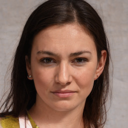 Joyful white young-adult female with medium  brown hair and brown eyes