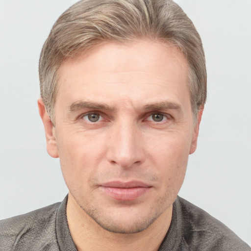 Neutral white adult male with short  brown hair and grey eyes