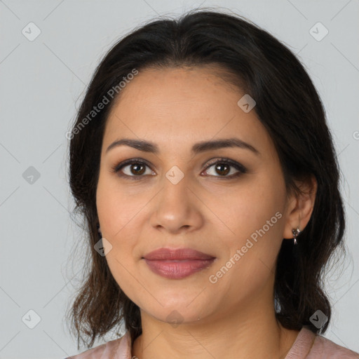 Joyful latino young-adult female with medium  brown hair and brown eyes