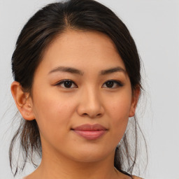 Joyful asian young-adult female with medium  brown hair and brown eyes