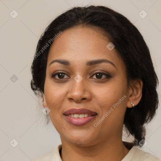 Joyful latino adult female with medium  brown hair and brown eyes