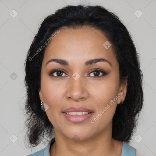 Joyful latino young-adult female with medium  brown hair and brown eyes