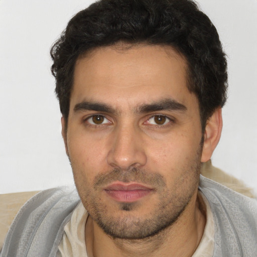 Neutral white young-adult male with short  black hair and brown eyes