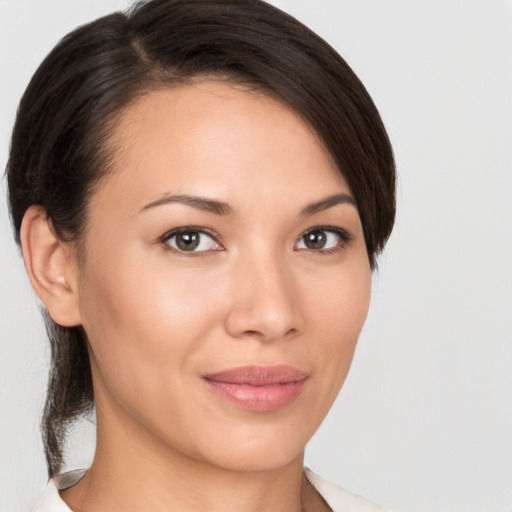 Joyful white young-adult female with medium  brown hair and brown eyes