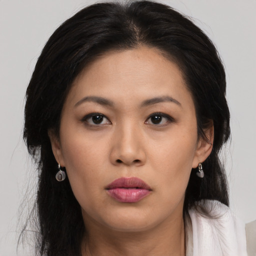 Neutral latino young-adult female with long  black hair and brown eyes