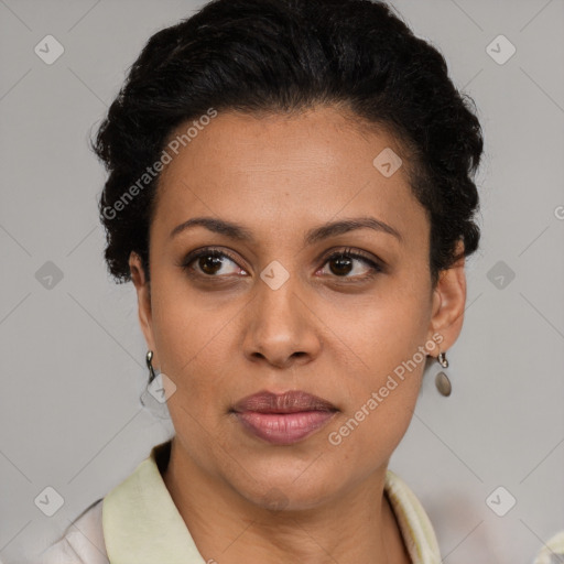 Joyful latino adult female with short  brown hair and brown eyes