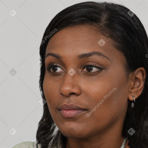 Joyful black young-adult female with medium  black hair and brown eyes