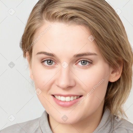 Joyful white young-adult female with medium  brown hair and blue eyes