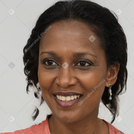 Joyful latino adult female with medium  brown hair and brown eyes